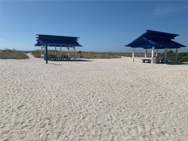 Tiki shelters on the beach | Image 59