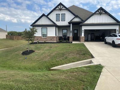 View of front of home featuring a garage and a front lawn | Image 2