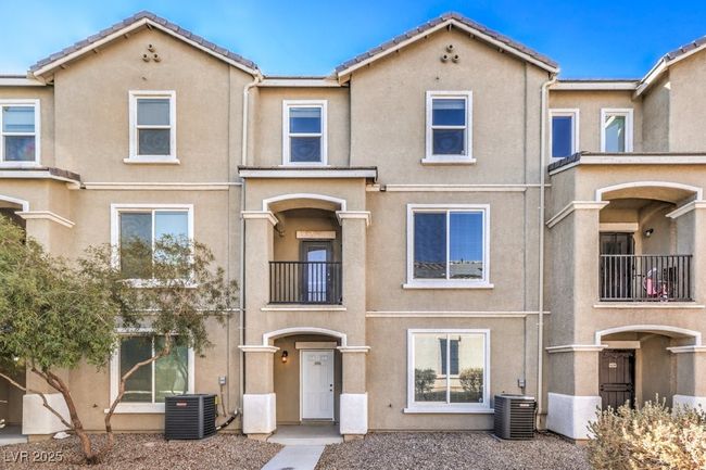 Multi unit property featuring stucco siding, cooling unit, and a tiled roof | Image 29