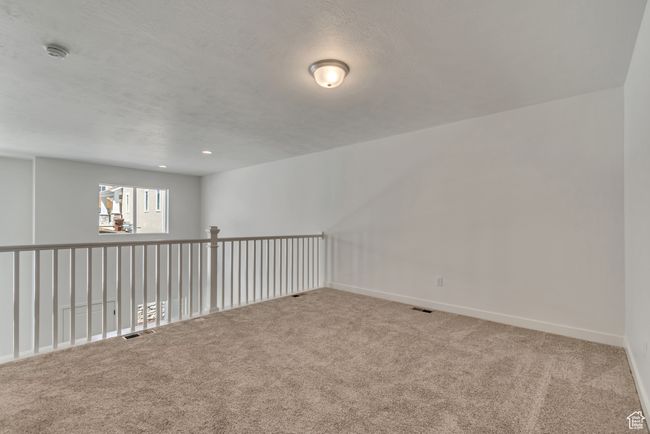 Spare room with baseboards, carpet flooring, and visible vents | Image 6