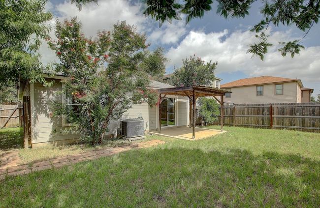View of yard featuring a pergola, and a patio area | Image 38
