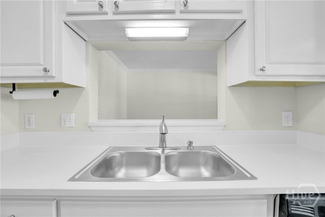 Kitchen sink looking into Living Room | Image 13
