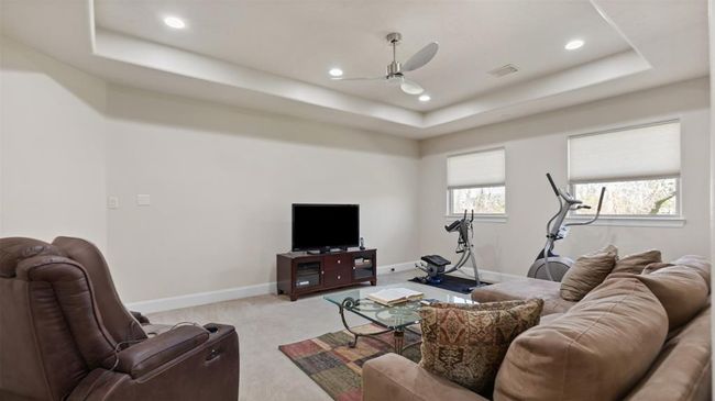 Let the kids enjoy the "Fun Room" of the house! The tray ceiling, recessed lighting and shaded windows still offers comfort and convenience at every turn. | Image 35