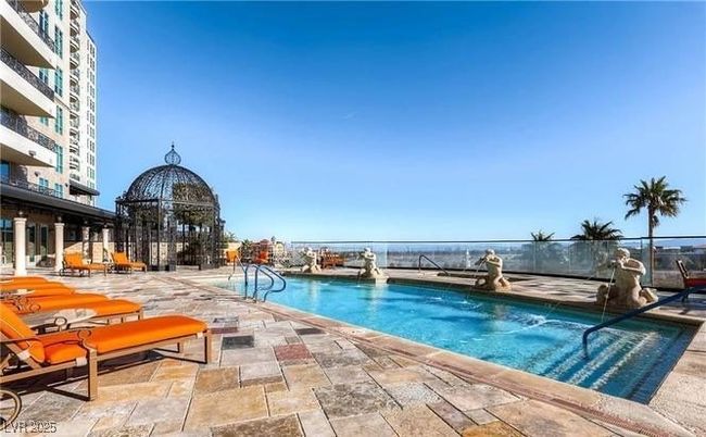 Community pool with a patio | Image 32