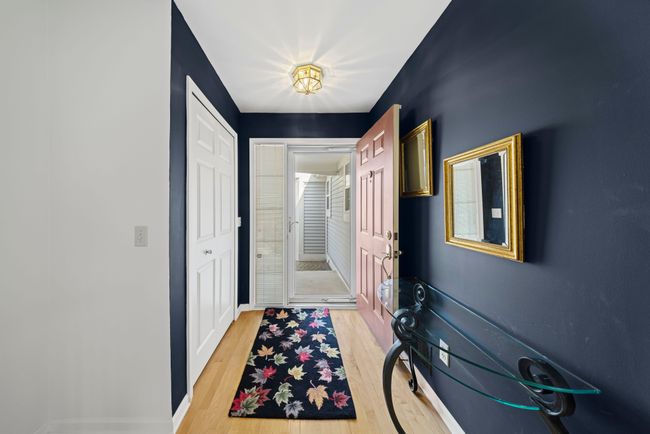 Come on in! Wood floor entry foyer w/ coat closet | Image 7