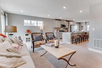 Open and bright, with a sliding door that leads to your huge 20x6 foot deck - perfect for lounging and grilling! Model home, details will vary. | Image 3