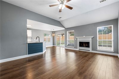 Open floor plan - Living area with gas log fireplace | Image 2