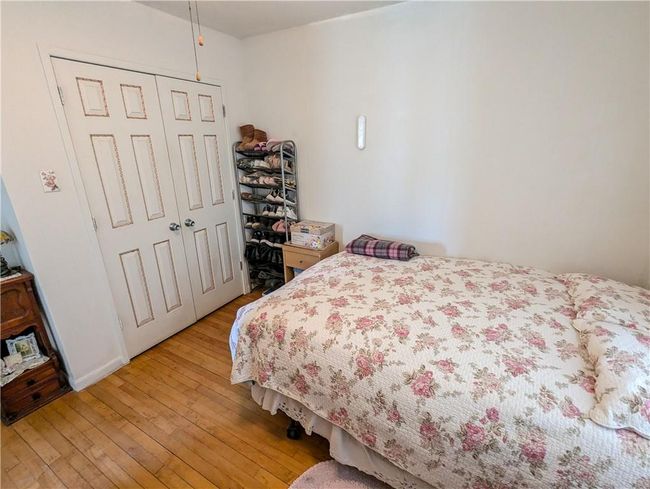 Bedroom featuring a closet and light wood-style flooring | Image 25