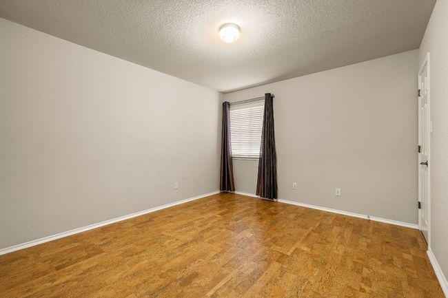 secondary bedroom has a walk in closet | Image 26