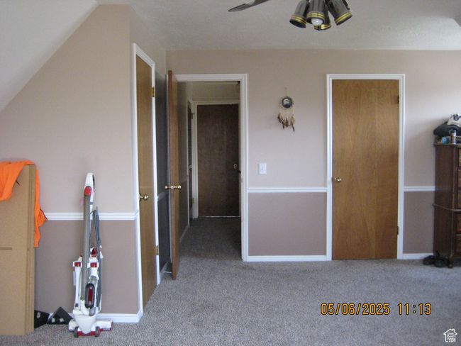 Unfurnished bedroom with baseboards and carpet floors | Image 15