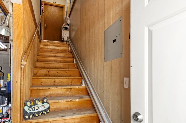 Stairs with wooden walls and electric panel | Image 63