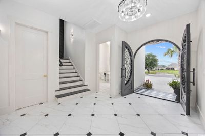 Entryway with a notable chandelier | Image 3