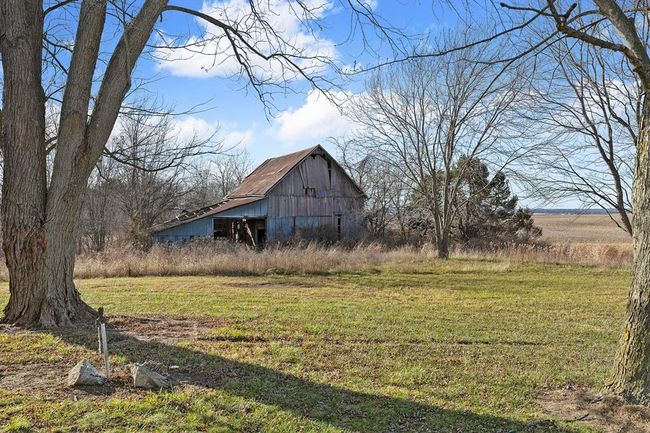 View of green lawn with a barn and an outbuilding | Image 26