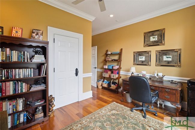 A study is located next to the powder room, just off the family room. | Image 18