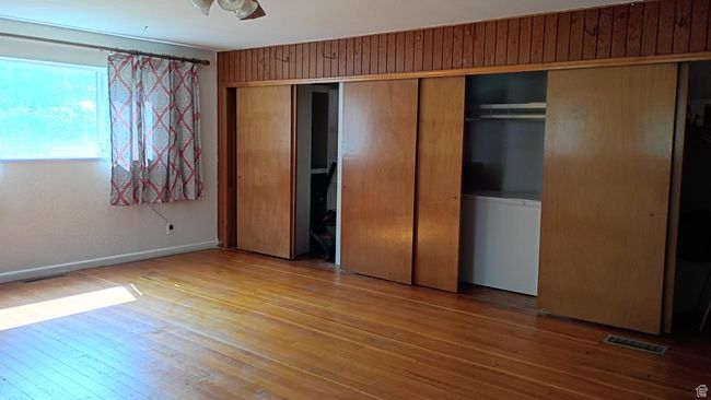 Family room featuring wood-style floors and a closet. | Image 40