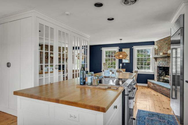 The Center Island, Custom Pantry, High-End Appliances And A Charming Fireplace Takes The Kitchen To The Next Level | Image 9