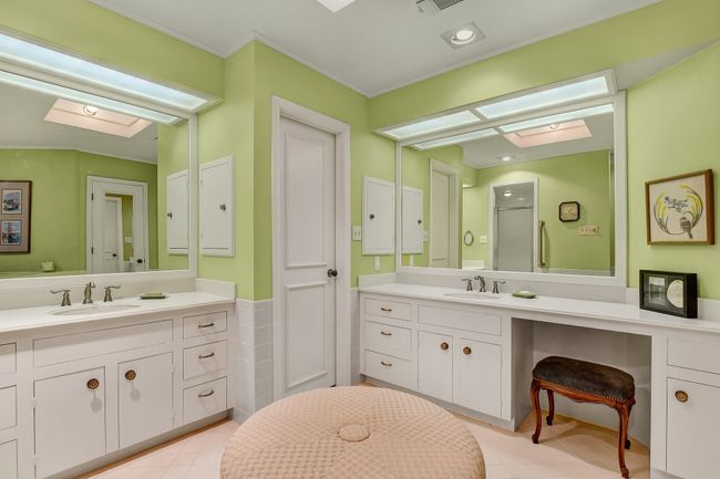 Full bathroom with a skylight, vanity, tile patterned flooring, and crown molding | Image 24