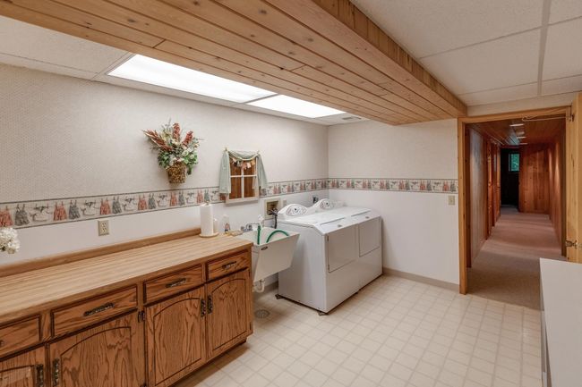 Oversized lower level laundry room. | Image 35