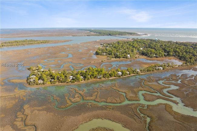 Hightide water view in front of home beyond the berm. | Image 63