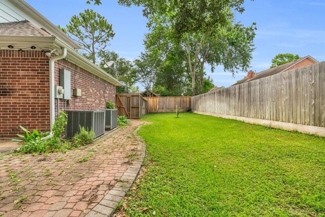 Backyard is fenced in. | Image 35