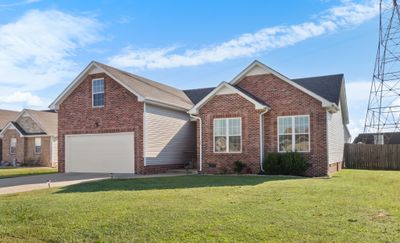 A well maintained contemporary ranch home on a large lot with 400sf of unfinished space above the garage currently used as storage. | Image 2