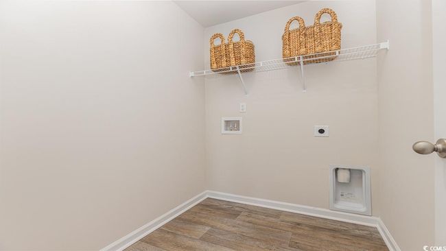 Laundry room with wood-type flooring, hookup for an electric dryer, and hookup for a washing machine | Image 22