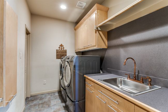 Located just off the primary closet and near the other bedrooms | Image 22