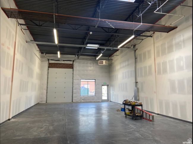 Garage featuring a wall mounted AC | Image 7