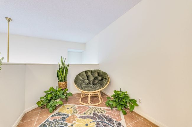 Sitting room with tile patterned flooring and baseboards | Image 18