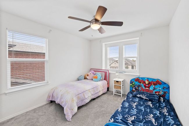 Bedroom featuring carpet and ceiling fan | Image 24