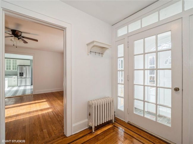 A view of the dining room and kitchen from the formal entryway. | Image 21