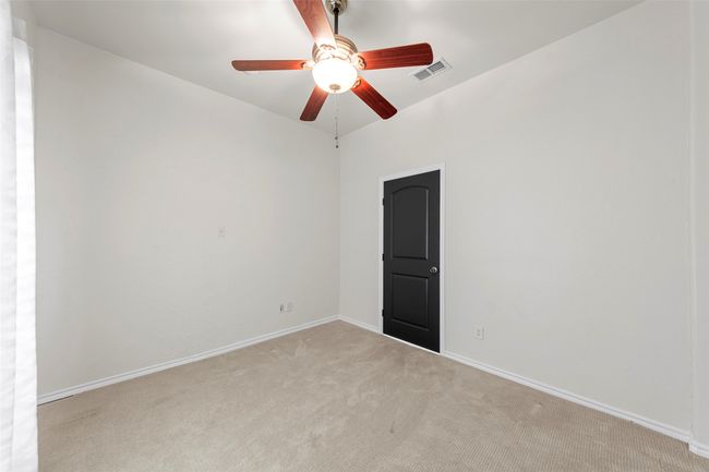 Unfurnished room featuring visible vents, ceiling fan, carpet flooring, and baseboards | Image 30
