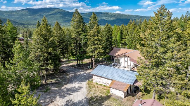 View of subject property with a forest and mountains | Image 81