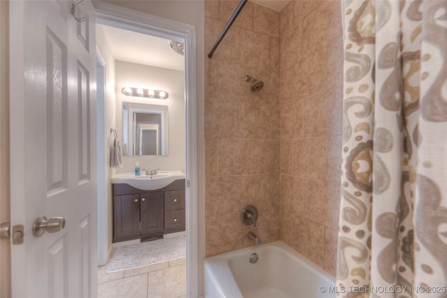 Primary bath connects to the hall bath in a Pullman-style layout. Both baths connect to the shared shower/tub combo in the middle. | Image 19
