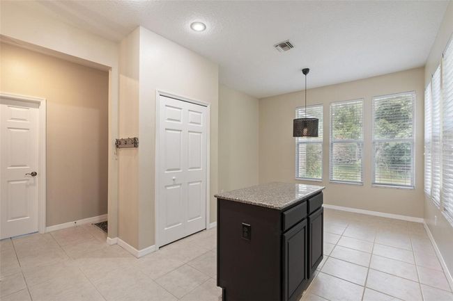 11933 Pasco Trails Blvd, House other with 4 bedrooms, 3 bathrooms and null parking in SPRING HILL FL | Image 13