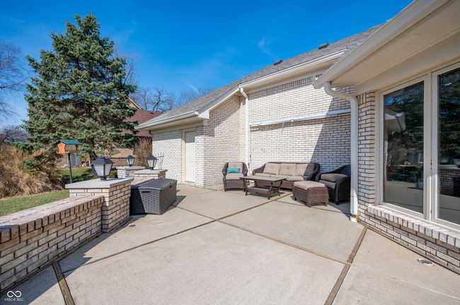 view of patio with an outdoor hangout area | Image 34