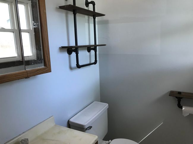Half bathroom featuring toilet and a healthy amount of sunlight | Image 9