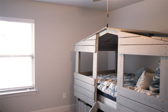 Bedroom featuring baseboards | Image 18
