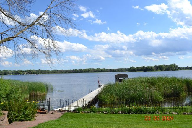 Expansive 124 foot dock surrounded by well maintained garden beds and lawn | Image 42