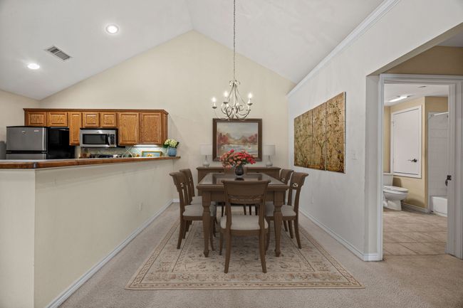 Spacious dining room with vaulted ceiling. | Image 5