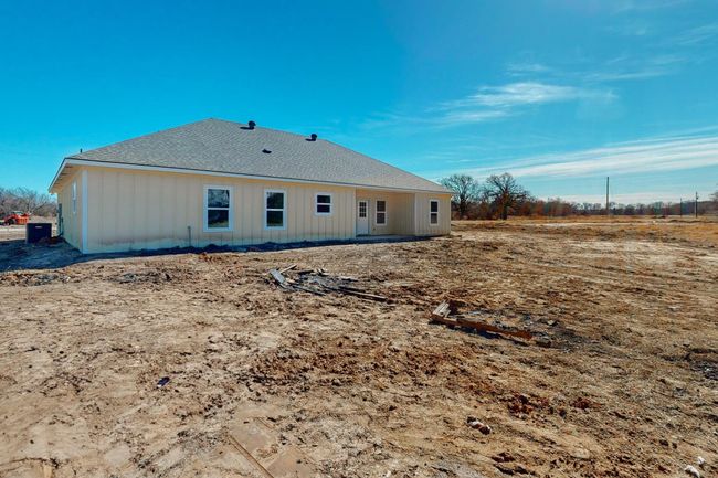Rear view of house featuring roof with shingles | Image 6