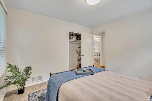 Carpeted bedroom featuring a closet | Image 11