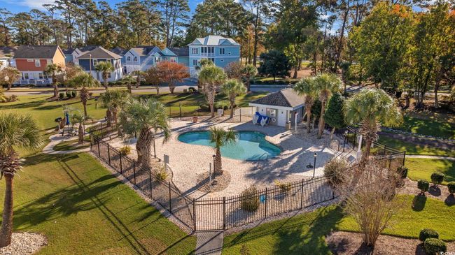 Community pool with a patio and a residential view | Image 34