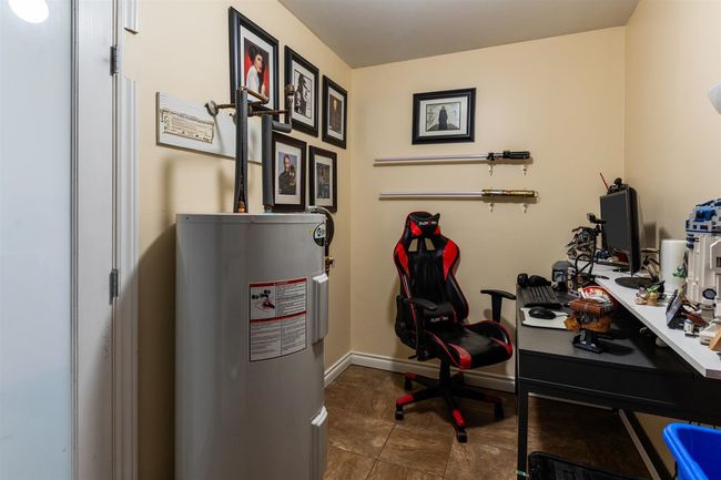 Office area with water heater and baseboards | Image 22