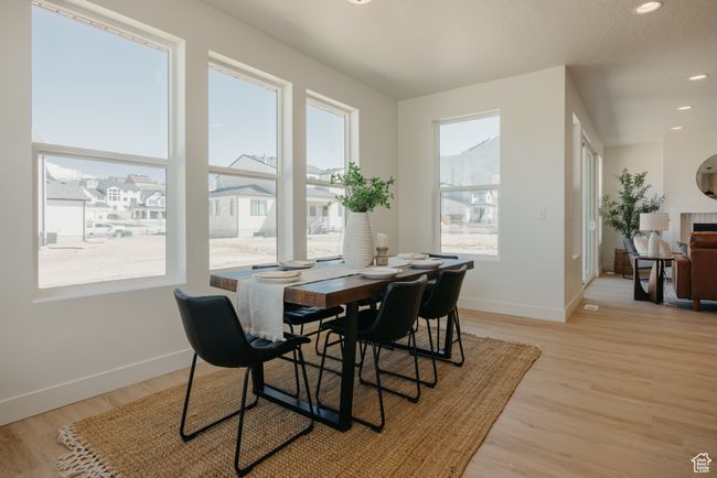 Dining space with recessed lighting, light wood-type flooring, and baseboards | Image 12
