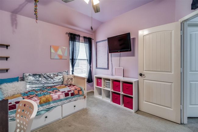 Bedroom with carpet, vaulted ceiling, and ceiling fan | Image 19