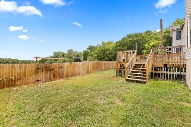 View of yard featuring a deck and stairs | Image 40