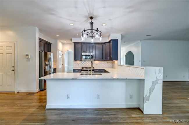 Large quartz countertop bar. | Image 12