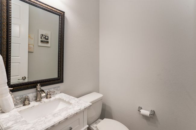Bathroom featuring vanity and toilet | Image 18