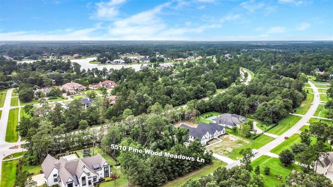 Build your dream home on this stunning wooded lot, where possibilities abound—whether you envision a timeless traditional design or a sleek modern retreat. Located in the prestigious Bender’s Landing Estates, this property offers more than just beautiful surroundings. | Image 6